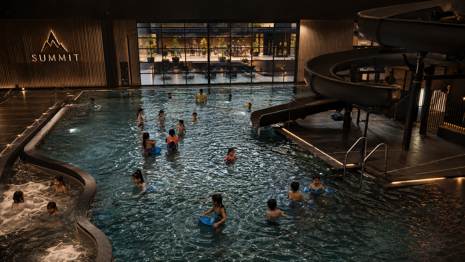 Water park techado con área de toboganes para niños en SUMMIT Wellness Club